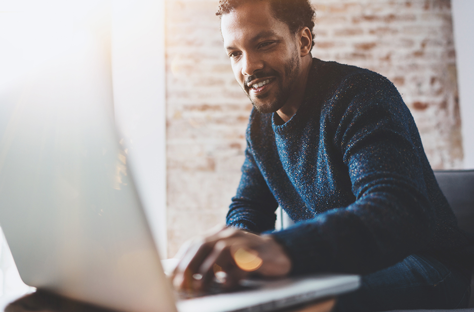 Man using Avenue on laptop